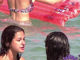 Two italian girls playing under rub-down the water on rub-down the imported margin