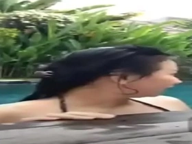 Indonesian fuck in pool by means of live
